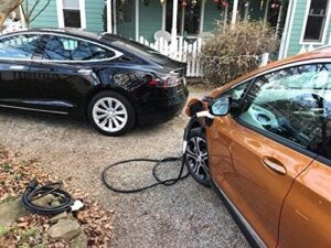 Tesla Model Y charging at public station with 50A J1772 adapter